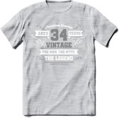 34 Jaar Legend T-Shirt | Zilver - Wit | Grappig Verjaardag en Feest Cadeau | Dames - Heren - Unisex | Kleding Kado | - Licht Grijs - Gemaleerd - M