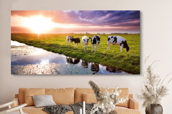Tableau sur toile Vaches pendant un coucher de soleil - 160x80 cm - Décoration murale Art