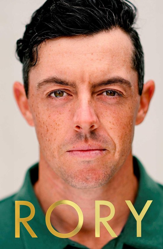 Gros plan du visage de Rory McIlroy avec le mot 'RORY' en dorure en bas.