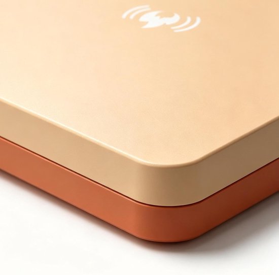 Close-up van de hoek van het beige en oranje vogelverwarmingspaneel met een hitte-symbool.