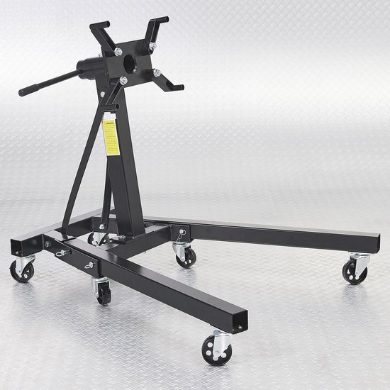 Support moteur noir et robuste avec quatre roulettes pivotantes et un mécanisme de rotation.