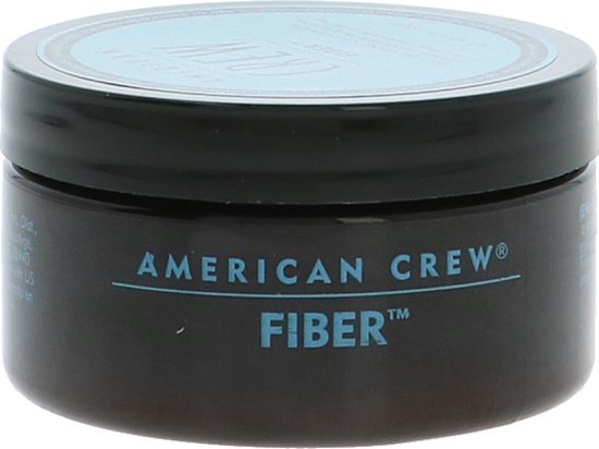 Zwarte American Crew Fiber pot met blauwe tekst.