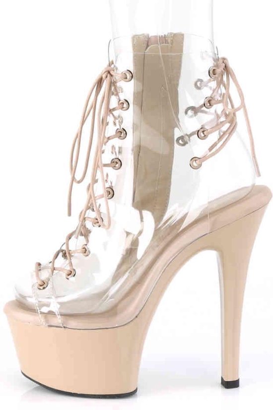 Botte compensée beige à tige transparente, lacets et fermeture éclair.