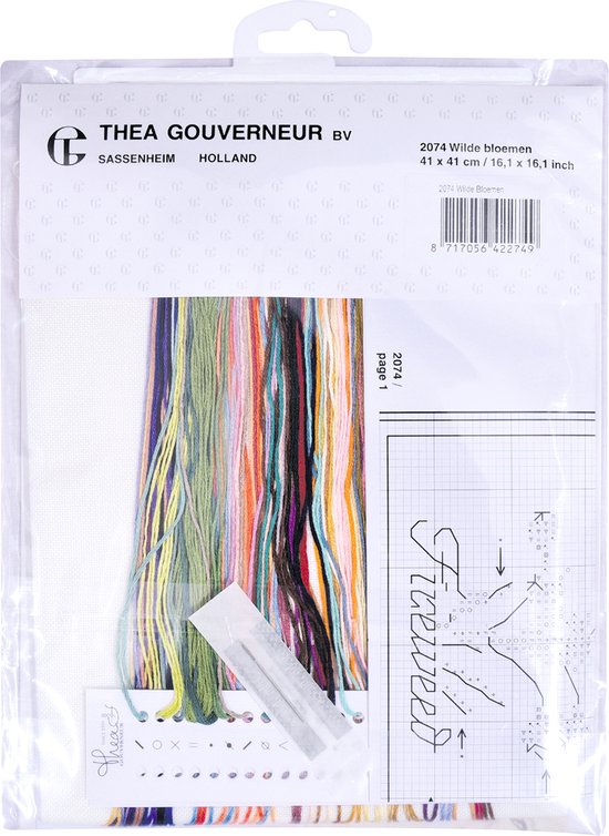 Emballage d'un kit de point de croix pour coussin fleurs sauvages, fils DMC, diagramme et tissu.