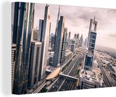 Canvas Schilderij Wolkenkrabbers in dubai - 90x60 cm - Wanddecoratie