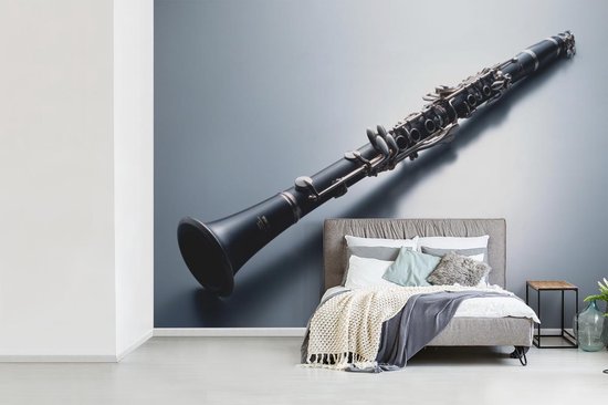 Papier peint Papier peint photo en vinyle - Une clarinette sur fond gris largeur 330 cm x hauteur 240 cm - Tirage photo sur papier peint (disponible en 7 tailles)
