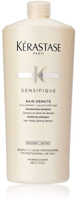 Een grote beige Kérastase Bain Densité shampoo fles, 1000 ml, met 'FOR PROFESSIONAL USE ONLY' tekst.