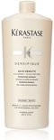 Een grote beige Kérastase Bain Densité shampoo fles, 1000 ml, met 'FOR PROFESSIONAL USE ONLY' tekst.