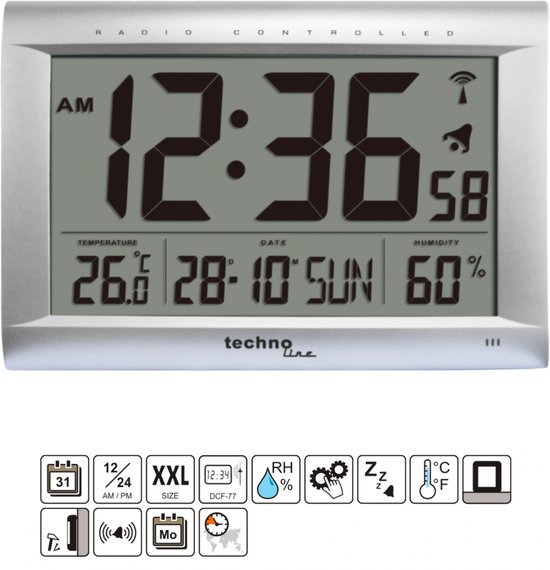 Zilverkleurige radio-gestuurde klok met grote zwarte cijfers. Toont tijd, datum, temperatuur (26.0 C) en luchtvochtigheid (60%). Iconen voor datum, 12/24u, alarm en temperatuur.