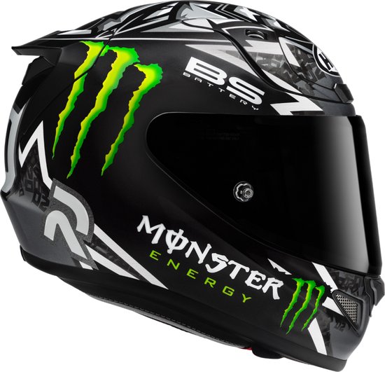 Zwarte HJC integraalhelm met groene Monster Energy logo's, 'BS BATTERY' en andere witte en grijze grafische elementen.