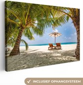 Palmiers sur une plage tropicale pendant un coucher de soleil Toile 120x80 cm - Tirage photo sur toile (Décoration murale salon / chambre) / Mer et plage