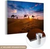 MuchoWow® Glasschilderij 90x60 cm - Schilderij acrylglas - Man in het Midden-Oosten met kamelen - Foto op glas - Schilderijen