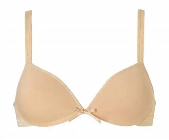 Nude voorgevormde bh met stippenrand en strikje. Op een witte achtergrond.