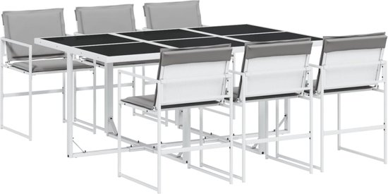 Eettafel met zes stoelen met grijze kussens, allemaal met witte metalen frames.