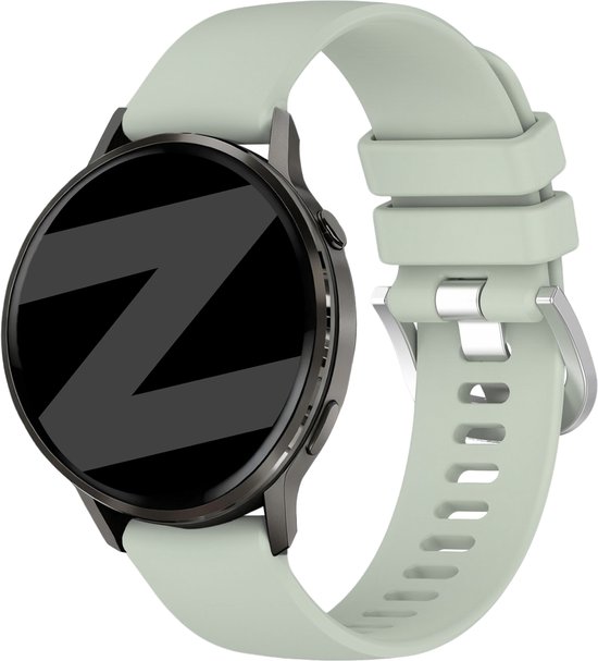 Lichtgroen Bandz smartwatchbandje met zilveren gesp en donkergrijs horloge met reflecterend Z-patroon op het zwarte scherm.