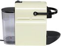 Vue latérale d'une machine à café à capsules Nespresso Inissia crème.