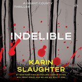 Livre 'Indelible' par Karin Slaughter, un thriller avec des éclaboussures rouges sur la couverture, devant une forêt d'arbres noirs.