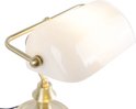 Lampe de banquier avec un abat-jour en verre blanc et un cadre en métal doré, sur fond blanc.
