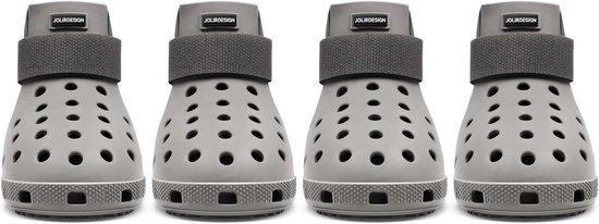 Vier grijze hondenschoenen op een witte achtergrond. Elke schoen heeft een verstelbare klittenbandsluiting en een antislipzool.