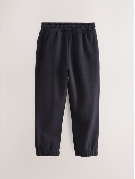 Donkerblauwe joggingbroek met elastische tailleband en zoom.