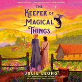 Boekomslag van 'The Keeper of Magical Things'. Twee vrouwen staan met hun rug naar de kijker, kijkend naar een dorp en een vliegende zwarte kat. Goudkleurige tekst op een roze/paarse achtergrond.