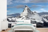 Behang - Fotobehang Wolken boven de Matterhorn in Zwitserland - Breedte 450 cm x hoogte 300 cm