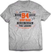 94 Jaar Legend - Feest kado T-Shirt Heren / Dames - Antraciet Grijs / Oranje - Perfect Verjaardag Cadeau Shirt - grappige Spreuken, Zinnen en Teksten. Maat XXL