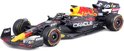 Modelauto van de Red Bull RB18 F1-auto in zwart met rode en gele accenten. "Oracle" en Red Bull logo prominent aanwezig.
