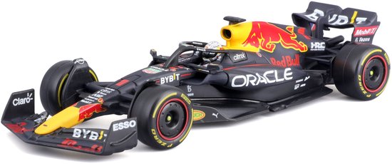 Modelauto van de Red Bull RB18 F1-auto in zwart met rode en gele accenten. "Oracle" en Red Bull logo prominent aanwezig.