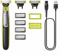 Gele en zwarte Philips OneBlade trimmer met verschillende mesjes en kammen, USB-kabel.