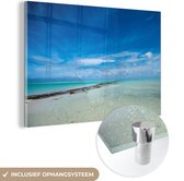 MuchoWow® Glasschilderij 60x40 cm - Schilderij acrylglas - Een uitzicht op de lagune van Aitutaki vanaf het One Foot Island - Foto op glas - Schilderijen