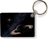 Sleutelhanger - De planeet Saturnus tegen een donkere hemel met een ster - Uitdeelcadeautjes - Plastic