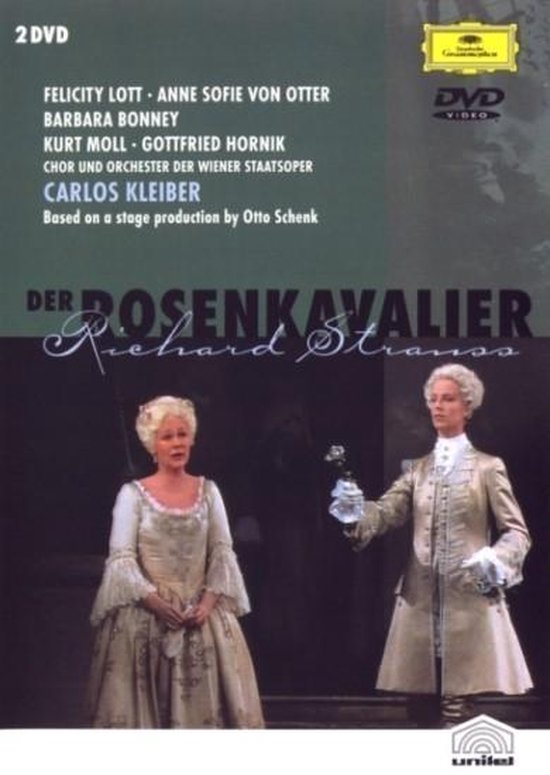 2 DVD: DER ROSENKAVALIER van Richard Strauss. Twee vrouwen in historische kostuums, één in een witte jurk, de ander in een beige jasje en broek.