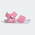 Roze Adidas kinder sandalen met witte golvende banden en drievoudig Adidas logo.
