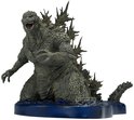 Grijze Godzilla figuur met scherpe rugplaten, knielend op een blauwe waterbasis.