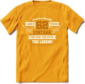 62 Jaar Legend T-Shirt | Goud - Wit | Grappig Verjaardag en Feest Cadeau Shirt | Dames - Heren - Unisex | Tshirt Kleding Kado | - Geel - S