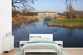 Behang - Fotobehang Den Bosch in de winter en een bevroren rivier in Nederland - Breedte 600 cm x hoogte 400 cm