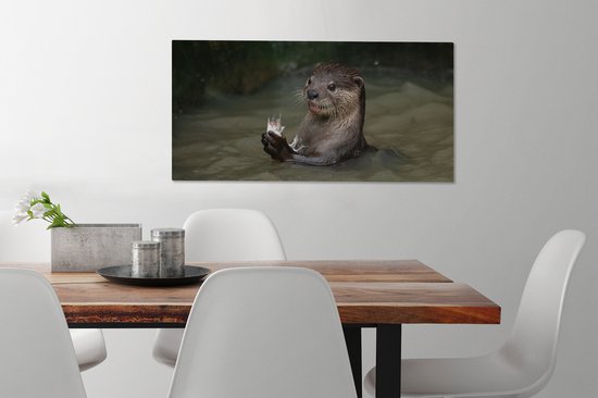 Tableau sur toile Loutre avec de la nourriture dans l'eau - 80x40 cm - Décoration murale