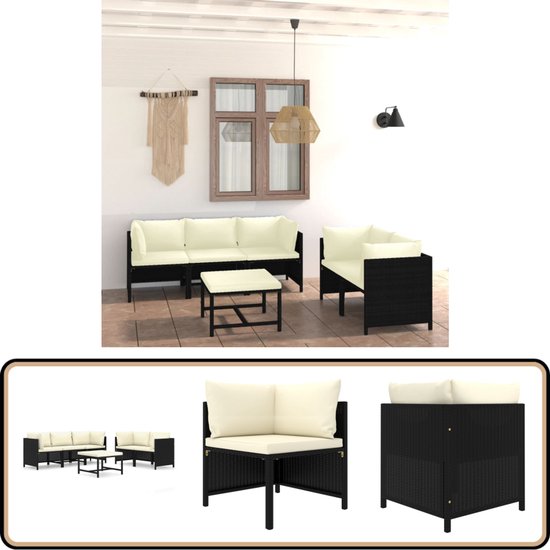 Disposition du salon noir avec coussins crème et table.