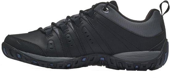 Zij-aanzicht van een zwarte Columbia wandelschoen met grijze accenten en donkerblauwe zool.