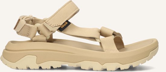 Beige Teva sandaal, zijaanzicht, met klittenbandsluiting en dikke zool.