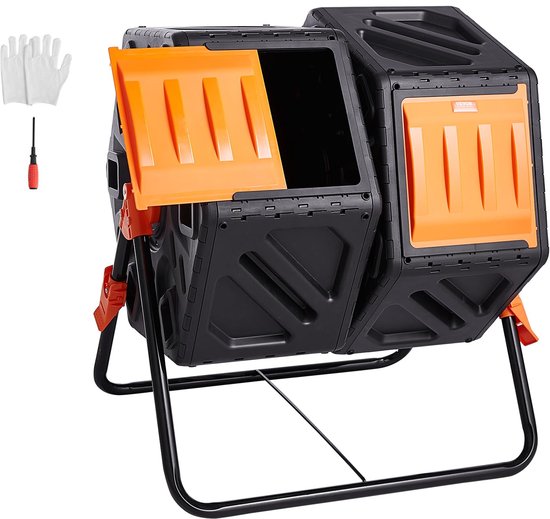 Zwarte composttrommel met dubbele kamer, oranje deuren en metalen frame, staand op witte achtergrond. Naast de trommel liggen witte handschoenen en een schroevendraaier.