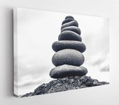 Stones pyramid on pebble beach symbolizing stability, zen, harmony, balance. Shallow depth of field - Modern Art Canvas - Horizontal - 561959941 - 80*60 Horizontal