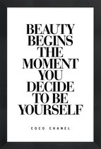 JUNIQE - Poster in houten lijst Beauty Begins - Coco Chanel quote