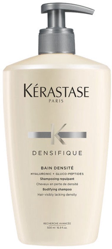 Een beige Kérastase Bain Densité shampoo fles met pompje, 500 ml.