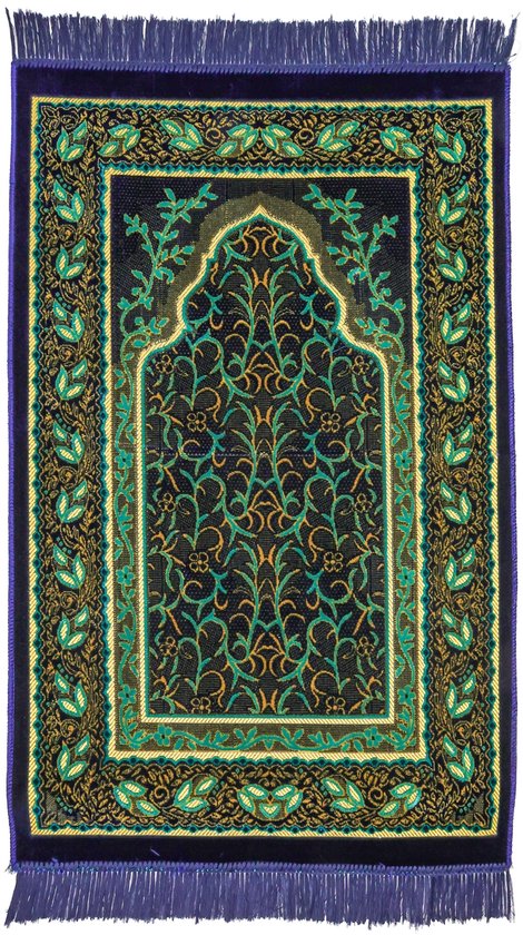 Tapis de prière bleu foncé avec une arche de mosquée, entouré de motifs de feuilles verts et dorés et de franges bleues.