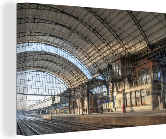 Canvas schilderij 150x100 cm - Wanddecoratie Station - Trein - Haarlem - Muurdecoratie woonkamer - Slaapkamer decoratie - Kamer accessoires - Schilderijen