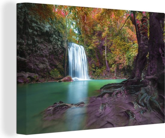 Canvas Schilderij Kleurrijke bladeren bij een waterval van het Nationaal park Erawan in Thailand - 120x80 cm - Wanddecoratie