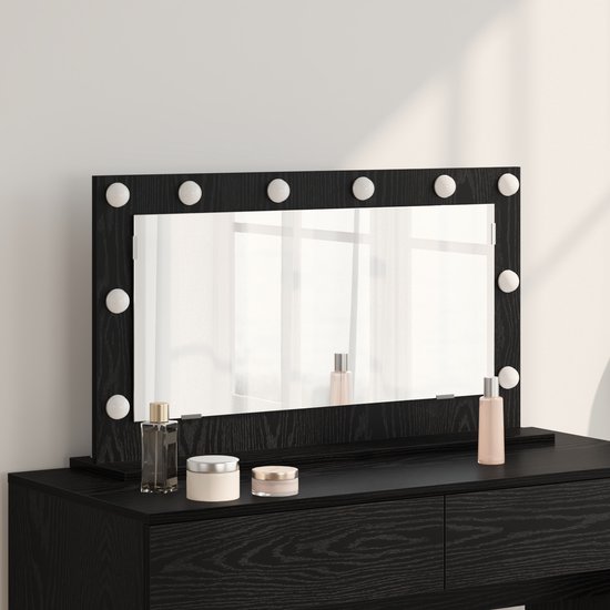 Miroir de maquillage noir avec 12 ampoules, une étagère et des cosmétiques.