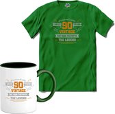 90 Jaar vintage legend - Verjaardag cadeau - Kado tip - T-Shirt met mok - Meisjes - Kelly Groen - Maat 12 jaar
